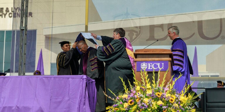 Ronnie Barnes is acknowledged with the ECU honorary degree of Doctor of Letters during campus-wide commencement.