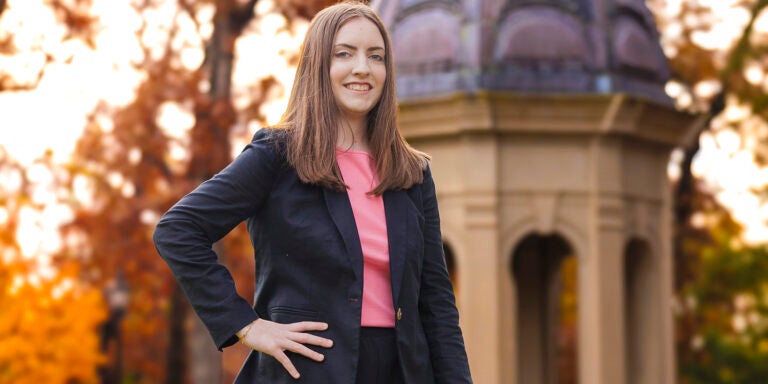 Student Chloe Cannon stands in front of the Cupola.