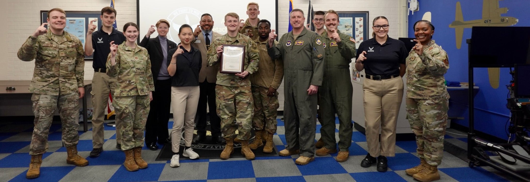 Representatives of ECU Air Force ROTC receive the official Congressional Record.