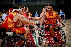 Andrew Hairston, smiles, while competing for Team Marine Corps in wheelchair basketball at the 2022 DoD Warrior Games in Orlando. (U.S. Marine Corps photo by Cpl. Mellizza Bonjoc)