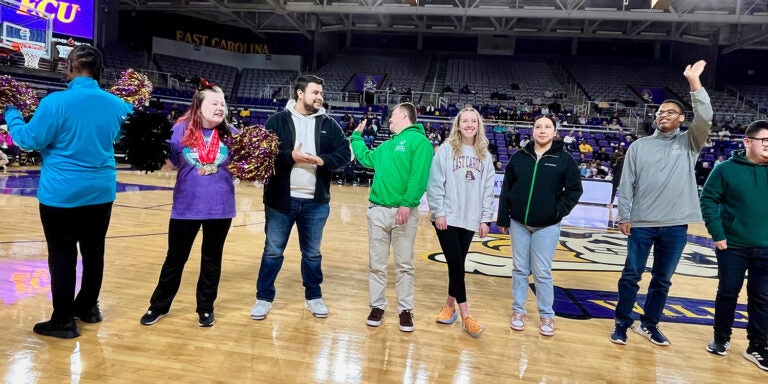 Students and Special Olympics athletes from the group of Erik Martinez-Santoyo, Jacquelin Acuna Mendoza, Jillian Conroy, Marcos Ardon Lobos, Elijah White, Gabe McBride, Lana Foster and Princess Bristow were recognized in Minges Coliseum during an ECU women's basketball game Jan. 20, 2024. (Game photos by Ronnie Woodward)