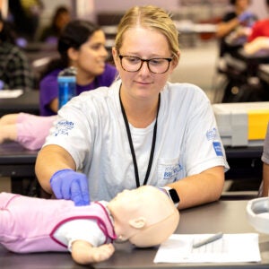 Student at CPR training at ECU.