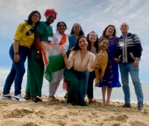 Group photo on a beach.