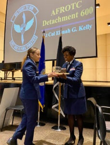 Tatiana Baier, left, smiles with Lt. Col. Elenah Kelly at the Air Force ROTC second lieutenant commissioning ceremony on East Carolina University main campus.