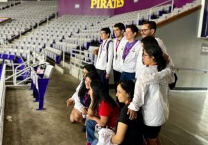 Peru delegates gather for a photo in Minges Coliseum on East Carolina University's athletics campus. (Ronnie Woodward)