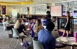 Drs. Eboni Baugh and Stacy Warner talk to graduate students. 