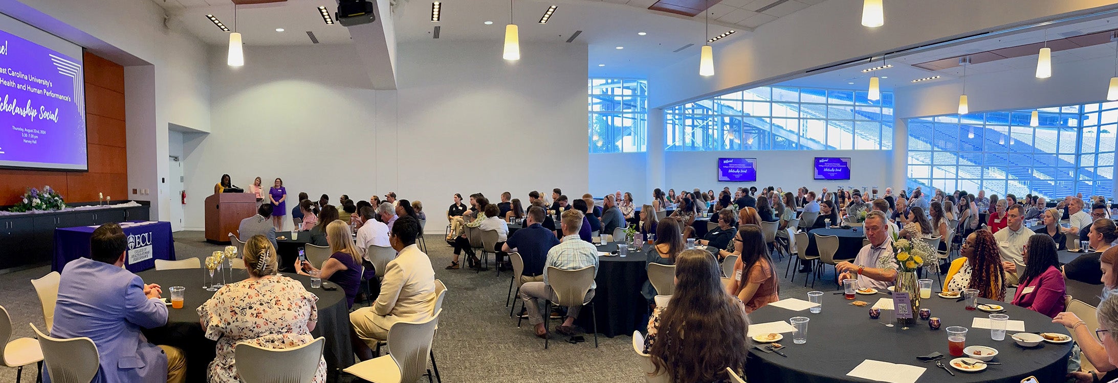 Two-time ECU School of Social Work alum Kashayia Coltrane speaks to attendees at the 2024-25 ECU HHP Scholarship social event.