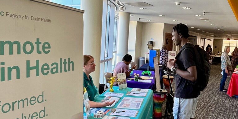 A student visits the NC Registry for Brian Health table at the Alzheimer’s and dementia resource fair in Joyner Library. (Photos by Ronnie Woodward)