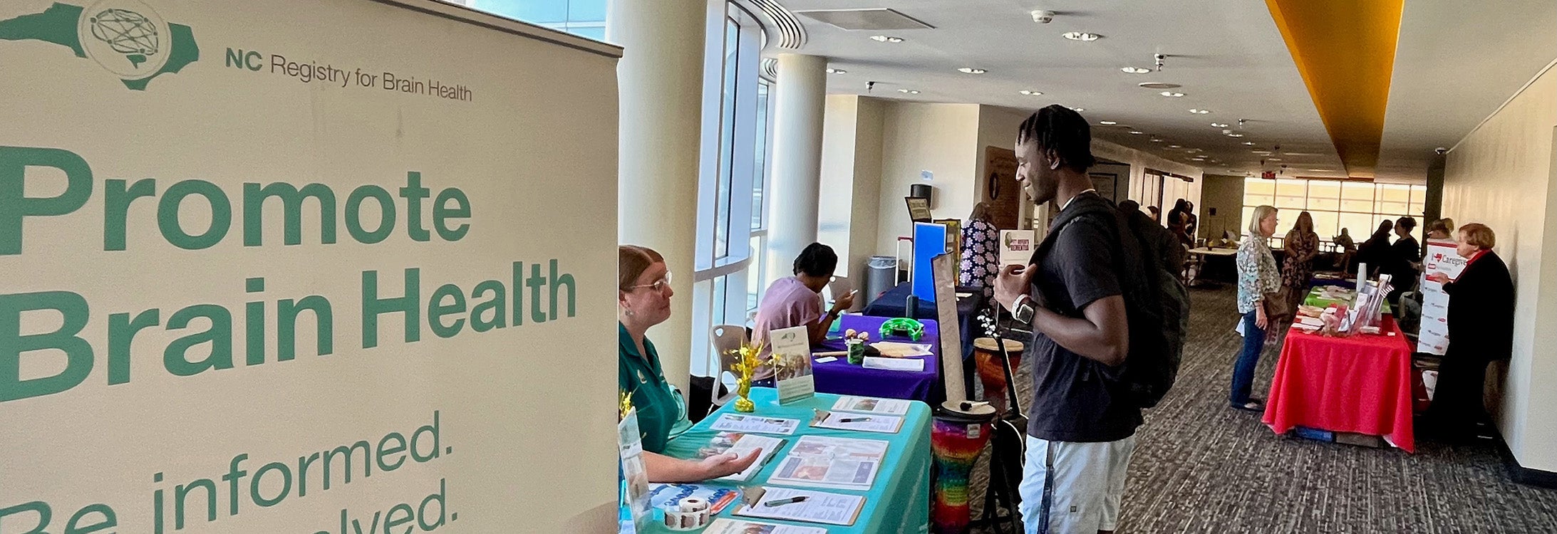 A student visits the NC Registry for Brian Health table at the Alzheimer’s and dementia resource fair in Joyner Library. (Photos by Ronnie Woodward)