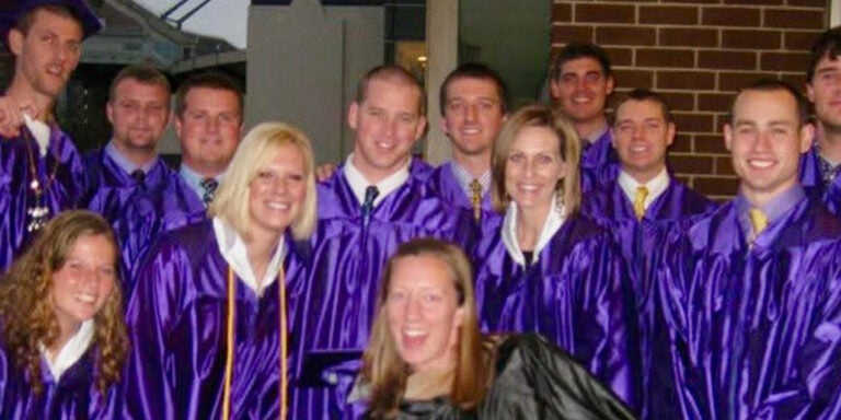 Group of college graduates in their gowns.