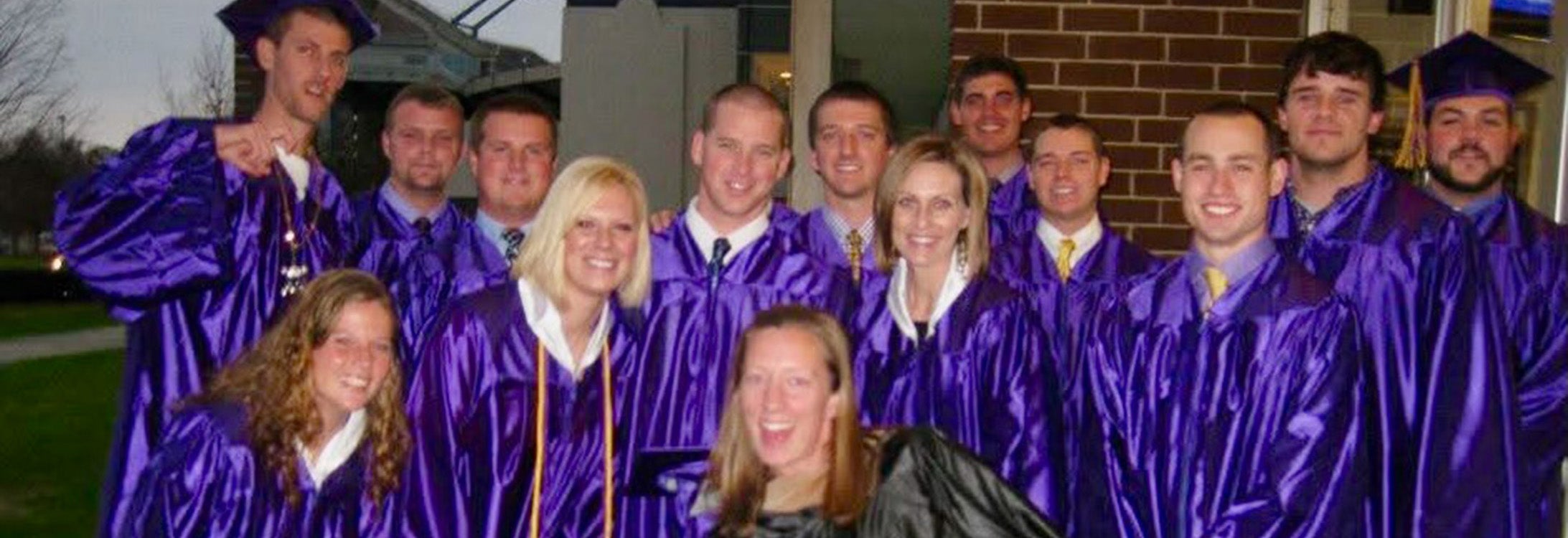 Group of college graduates in their gowns.
