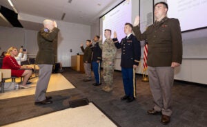 Army ROTC cadets take the Oath of Office commissioned as second lieutenants.(ECU Photo by Rhett Butler)