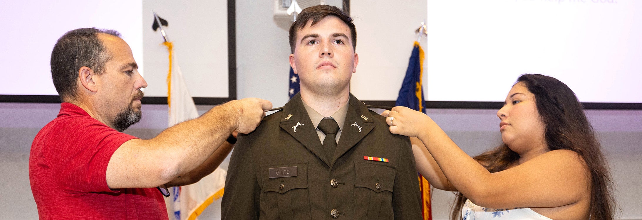 Kody Giles is pinned by family representatives during the East Carolina University Army ROTC Pirate Battalion summer commissioning ceremony Aug. 2, 2024. (ECU Photo by Rhett Butler)