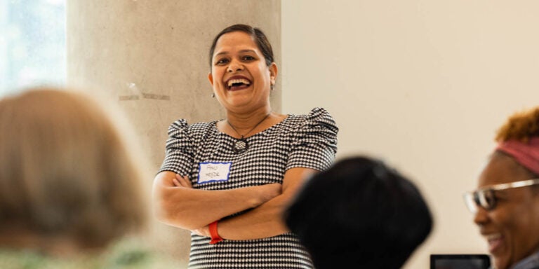 Dr. Archana Hegde talks to statewide evaluators and mentors during a 15-year celebration of ECU's Early Educators Support program. (Photo by Cliff Hollis)