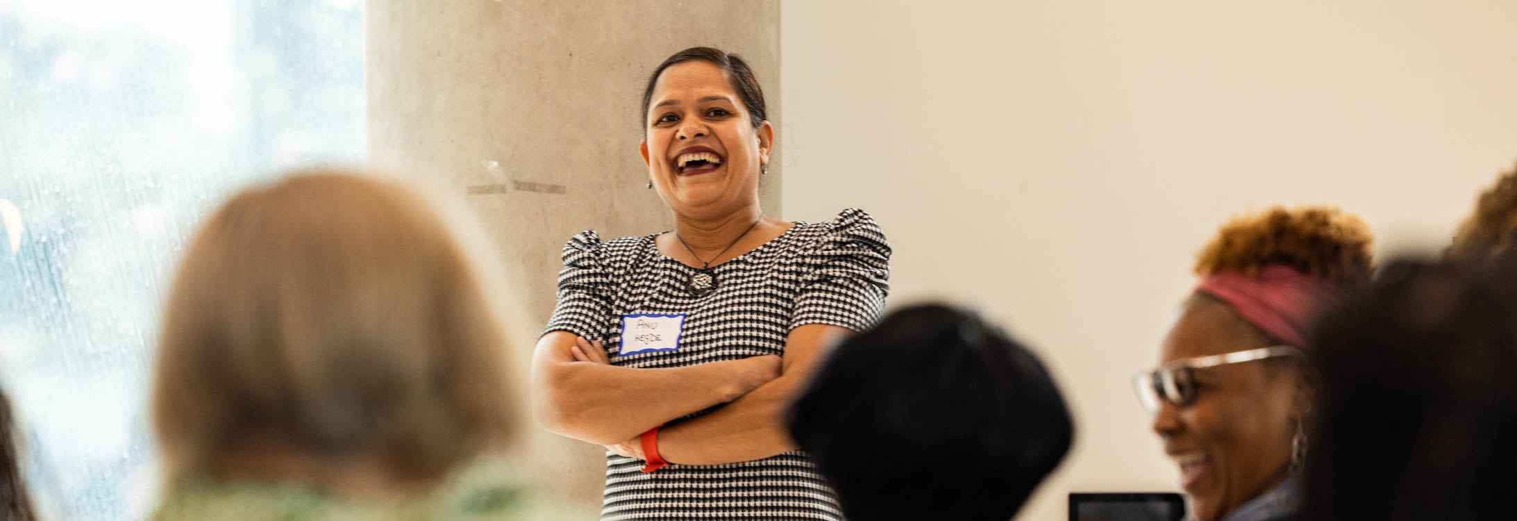 Dr. Archana Hegde talks to statewide evaluators and mentors during a 15-year celebration of ECU's Early Educators Support program. (Photo by Cliff Hollis)