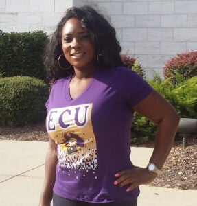 Tanikia "Niki" Cobb standing outside wearing a purple shirt.
