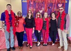 Health education and promotion faculty members take a photo together on the American Heart Association’s Wear Red Day.