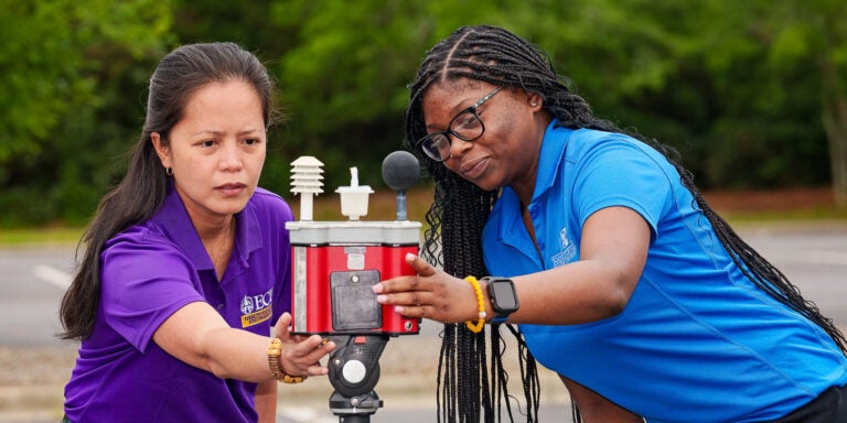 Jo Anne Balanay and FSU student setting up heat monitoring equipment. This is part of Glaxo Smith Kline Foundation funding for the ECU STEM Summer Immersion programs.